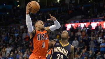 Nov 20, 2016; Oklahoma City, OK, USA; Oklahoma City Thunder guard Russell Westbrook (0) drives to the basket against Indiana Pacers center Myles Turner (33) during the fourth quarter at Chesapeake Energy Arena. Mandatory Credit: Mark D. Smith-USA TODAY Sports