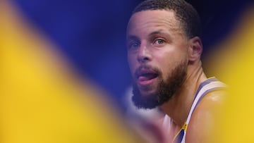 PHOENIX, ARIZONA - APRIL 08: Stephen Curry #30 of the Golden State Warriors sits on the bench during the first half of the NBA game against the Phoenix Suns at PHX Arena on April 08, 2025 in Phoenix, Arizona. NOTE TO USER: User expressly acknowledges and agrees that, by downloading and or using this photograph, User is consenting to the terms and conditions of the Getty Images License Agreement. Christian Petersen/Getty Images/AFP (Photo by Christian Petersen / GETTY IMAGES NORTH AMERICA / Getty Images via AFP)