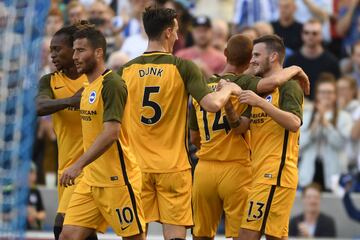 Brighton celebrate their 61st-minute equaliser, scored by Pascal Gross (right).