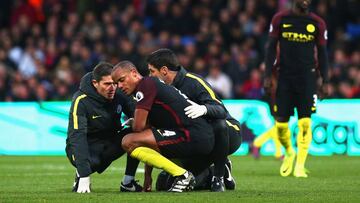 Vincent Kompany of Manchester City receives treatment from the medical team during the Premier League match between Crystal Palace and Manchester City