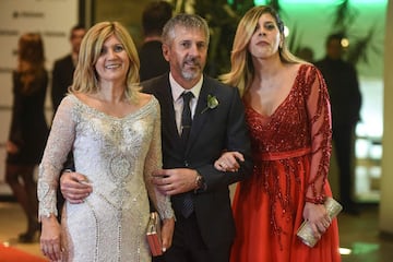 Argentine football star Lionel Messi's parents Jorge Horacio Messi (C) and Celia Maria Cuccittini and his sister Maria Sol Messi pose after Messi's wedding with Antonella Roccuzzo, at the City Centre Complex in Rosario, Santa Fe province,