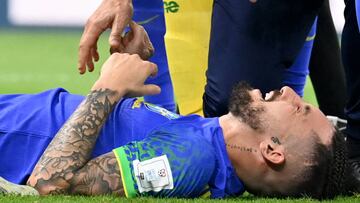 Brazil's defender #16 Alex Telles reacts after picking up an injury during the Qatar 2022 World Cup Group G football match between Cameroon and Brazil at the Lusail Stadium in Lusail, north of Doha on December 2, 2022. (Photo by Issouf SANOGO / AFP) (Photo by ISSOUF SANOGO/AFP via Getty Images)