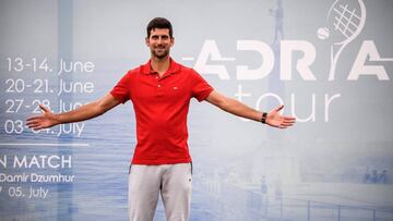 Serbian tennis player Novak Djokovic (ATP Number 1) poses for photographers after a press conference on the upcoming Adria Tour tennis tournament in Belgrade on May 25, 2020. - Djokovic will bring together international tennis stars Dominic Thiem (ATP Number 3), Alexander Zverev (ATP Number 7) and Grigor Dimitrov (ATP Number 19) to Belgrade in early June for the first in a series of humanitarian tournaments that he will organized in the Balkans. (Photo by Andrej ISAKOVIC / AFP)