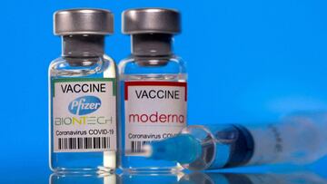 FILE PHOTO: Vials with Pfizer-BioNTech and Moderna coronavirus disease (COVID-19) vaccine labels are seen in this illustration picture taken March 19, 2021. REUTERS/Dado Ruvic/Illustration/File Photo