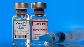 FILE PHOTO: Vials with Pfizer-BioNTech and Moderna coronavirus disease (COVID-19) vaccine labels are seen in this illustration picture taken March 19, 2021. REUTERS/Dado Ruvic/Illustration/File Photo