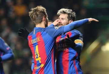Ivan Rakitic (left) and Leo Messi celebrate as Barça see off Celtic.