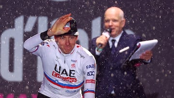 Team UAE's Slovenian rider Tadej Pogacar waves on stage during the opening ceremony and team presentation in Turin, on May 2, 2024, two days before the departure of the Giro d'Italia 2023 cycling race. The Giro d'Italia 2024 cycling race will depart from Venaria Reale near Turin on May 4, and finish in Rome on May 26. (Photo by Luca BETTINI / AFP)