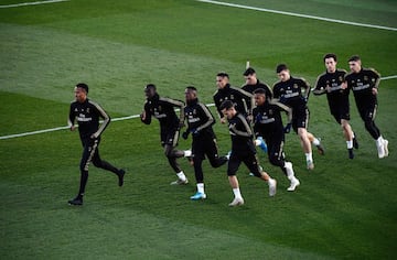Real Madrid's players run during a public training session at the Ciudad Real Madrid training ground in Valdebebas, Madrid, on December 30, 2019. (Photo by OSCAR DEL POZO / AFP)