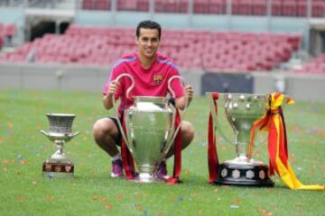 Pedro posa con la Supercopa de España, la Liga y la Champions en 2011.