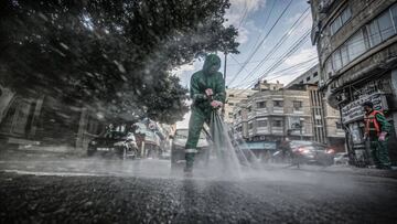 01 September 2020, Palestinian Territories, Gaza City: Gaza municipality workers spray disinfectant on the streets and buildings as a preventive measure against the spread of Coronavirus (COVID-19). Photo: Mohammed Talatene/dpa
 01/09/2020 ONLY FOR USE IN