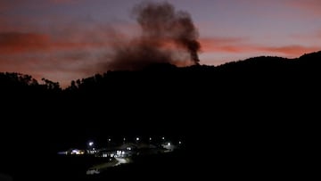 Smoke rises near Fort Tiuna during a full blackout, following explosions and loud noises, after U.S. President Donald Trump said the U.S. has struck Venezuela and captured its President Nicolas Maduro, in Caracas, Venezuela, January 3, 2026. REUTERS/Leonardo Fernandez Viloria TPX IMAGES OF THE DAY