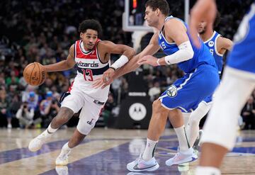 Nov 30, 2024; Milwaukee, Wisconsin, USA; Washington Wizards guard Jordan Poole (13) drives to the basket against Milwaukee Bucks center Brook Lopez (11) in the second half at Fiserv Forum. Mandatory Credit: Michael McLoone-Imagn Images