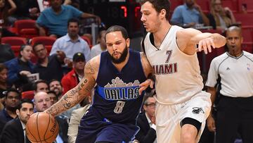 Jan 19, 2017; Miami, FL, USA; Dallas Mavericks guard Deron Williams (8) drives the ball around Miami Heat guard Goran Dragic (7) during the first half at American Airlines Arena. Mandatory Credit: Jasen Vinlove-USA TODAY Sports