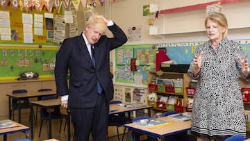 Head teacher Bernadette Matthews shows Prime Minister Boris Johnson the new measures being implemented to ensure children can return to school safely in September during his visit to St Joseph&#039;s Catholic Primary School in Upminster, east London. *** 