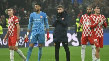 Girona's players look dejected at the end of the UEFA Champions League football match between AC Milan and Girona at San Siro stadium in Milan, on January 22, 2025. (Photo by Alberto PIZZOLI / AFP)