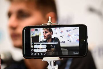 Uruguay's defender Guillermo Varela is seen on a mobile phone as he attends a press conference at the Sport Centre Borsky in Nizhny Novgorod on June 17, 2018.