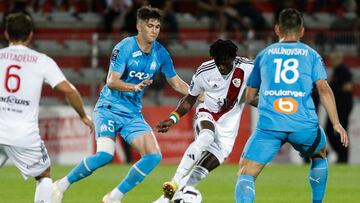 Marseille's Argentine defender Leonardo Balerdi (C-L) fights for the ball with Ajaccio's Ivorian defender Ismael Diallo during the French L1 football match between AC Ajaccio and Olympique Marseille (OM) at Stade Francois Coty in Ajaccio on the French Mediterranean Island of Corsica on June 3, 2023. (Photo by Pascal POCHARD-CASABIANCA / AFP)