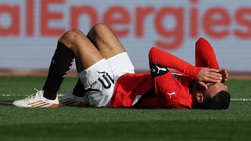 Egypt's forward #10 Mohamed Salah reacts after being fouled by South Africa's defender #20 Khuliso Mudau during the Africa Cup of Nations (CAN) Group B football match between Egypt and South Africa at Adrar Stadium in Agadir on December 26, 2025. (Photo by FRANCK FIFE / AFP)