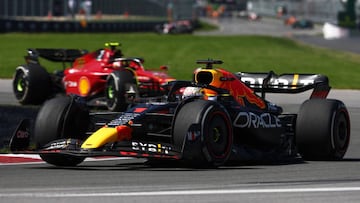 MONTREAL, QUEBEC - JUNE 19: Max Verstappen of the Netherlands driving the (1) Oracle Red Bull Racing RB18 leads Carlos Sainz of Spain driving (55) the Ferrari F1-75 during the F1 Grand Prix of Canada at Circuit Gilles Villeneuve on June 19, 2022 in Montreal, Quebec. (Photo by Lars Baron - Formula 1/Formula 1 via Getty Images)