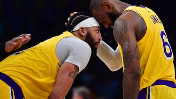 Apr 11, 2023; Los Angeles, California, USA; Los Angeles Lakers forward LeBron James (6) with forward Anthony Davis (3) during a stoppage in play against the Minnesota Timberwolves in the second half at Crypto.com Arena. Mandatory Credit: Gary A. Vasquez-USA TODAY Sports