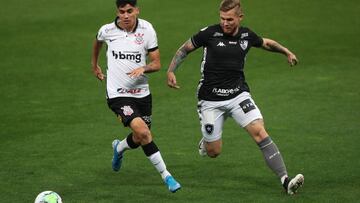 Soccer Football - Brasileiro Championship - Corinthians v Botafogo - Arena Corinthians, Sao Paulo, Brazil - September 5, 2020 Botafogo's Rafael Forster in action with Corinthians' Angelo Araos, following the resumption of play behind closed doors after th