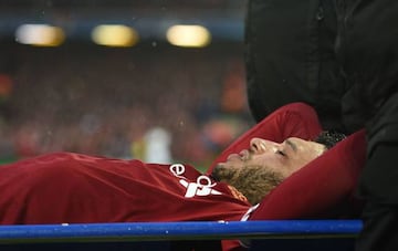 Liverpool's English midfielder Alex Oxlade-Chamberlain is stretchered off the pitch during the UEFA Champions League first leg semi-final football match between Liverpool and Roma at Anfield stadium