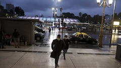 Men enter Constitucion station at rush hour during a government-ordered lockdown to curb the spread of the new coronavirus, in Buenos Aires, Argentina, Monday, April 13, 2020. (AP Photo/Natacha Pisarenko)