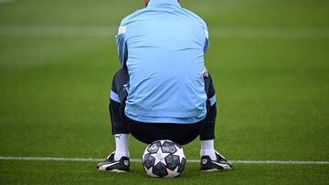 Manchester City's Spanish manager Pep Guardiola sits on a ball as he takes part in a team training session at Manchester City training ground in Manchester, north-west England on June 6, 2023, ahead of their UEFA Champions League final football match against Inter Milan. (Photo by Paul ELLIS / AFP)
