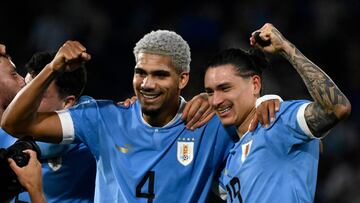 Uruguay's defender Ronald Araujo (L) and forward Darwin Nunez (R), the players who scored for Uruguay to defeat Argentina, pose for a picture after the end of the 2026 FIFA World Cup South American qualification football match between Argentina and Uruguay at La Bombonera stadium in Buenos Aires on November 16, 2023. (Photo by Luis ROBAYO / AFP)