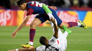 Barcelona's Spanish defender #33 Pau Cubarsi (Top) fights for the ball with Paris Saint-Germain's French forward #07 Kylian Mbappe during the UEFA Champions League quarter-final second leg football match between FC Barcelona and Paris SG at the Estadi Olimpic Lluis Companys in Barcelona on April 16, 2024. (Photo by Josep LAGO / AFP)