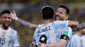 Soccer Football - World Cup - South American Qualifiers - Ecuador v Argentina - Estadio Monumental Banco Pichincha, Guayaquil, Ecuador - March 29, 2022 Argentina's Julian Alvarez celebrates scoring their first goal with Lionel Messi Pool via REUTERS/Franklin Jacome