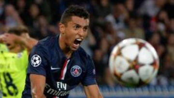 (FILES) -- This file photo taken on September 30, 2014 at the Parc des Princes stadium in Paris shows Paris Saint-Germain's Brazilian defender Marquinhos reacting after blocking a shot during the UEFA Champions League football match between Paris Saint-Germain (PSG) and Barcelona (FCB). Marquinhos has signed a new contract with Paris Saint-Germain until 2019, the club announced on March 26, 2015. AFP PHOTO / MIGUEL MEDINA