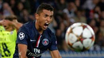 (FILES) -- This file photo taken on September 30, 2014 at the Parc des Princes stadium in Paris shows Paris Saint-Germain&#039;s Brazilian defender Marquinhos reacting after blocking a shot during the UEFA Champions League football match between Paris Saint-Germain (PSG) and Barcelona (FCB). Marquinhos has signed a new contract with Paris Saint-Germain until 2019, the club announced on March 26, 2015.  AFP PHOTO / MIGUEL MEDINA