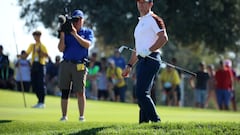 Team Europe's Rory McIlroy looks on after playing out of a bunker on the 14th hole during the Foursomes REUTERS/Phil Noble