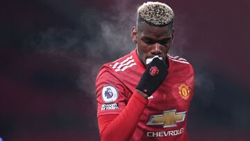 Manchester United's French midfielder Paul Pogba has to leave the field temporarily after receiving a knock during the English Premier League football match between Manchester United and Aston Villa at Old Trafford in Manchester, north west England,