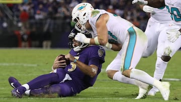 BALTIMORE, MD - OCTOBER 26: Quarterback Joe Flacco #5 of the Baltimore Ravens is hit by middle linebacker Kiko Alonso #47 of the Miami Dolphins as he slides in the second quarter against the Miami Dolphins at M&amp;T Bank Stadium on October 26, 2017 in Baltimore, Maryland.   Patrick Smith/Getty Images/AFP
 == FOR NEWSPAPERS, INTERNET, TELCOS &amp; TELEVISION USE ONLY ==