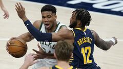 Milwaukee Bucks&#039; Giannis Antetokounmpo (34) goes to the basket against Indiana Pacers&#039; Oshae Brissett (12) during the second half of an NBA basketball game Thursday, May 13, 2021, in Indianapolis. (AP Photo/Darron Cummings)