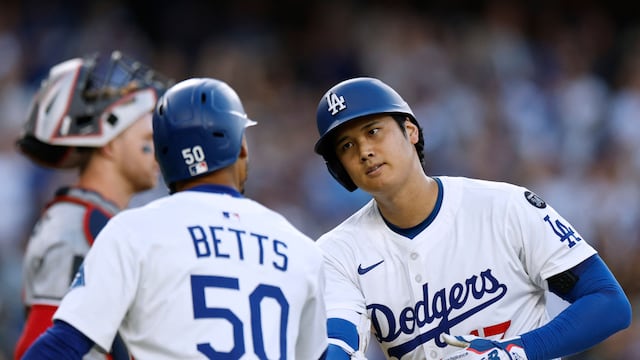 LOS ANGELES, CALIFORNIA - JULY 21: Shohei Ohtani #17 of the Los Angeles Dodgers celebrates his two run home run, with Mookie Betts #50 next to Ryan Jeffers #27 of the Minnesota Twins, to take a 2-1 lead, during the first inning at Dodger Stadium on July 21, 2025 in Los Angeles, California. Harry How/Getty Images/AFP (Photo by Harry How / GETTY IMAGES NORTH AMERICA / Getty Images via AFP)