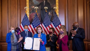 Nancy Pelosi shows off the bill that avoided the shutdown