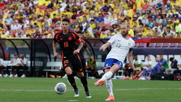 Jun 8, 2024; Landover, Maryland, USA; United States defender Tim Ream (13) passes the ball as Colombia midfielder James Rodriguez (10) defends in the second half at Commanders Field. Mandatory Credit: Geoff Burke-USA TODAY Sports