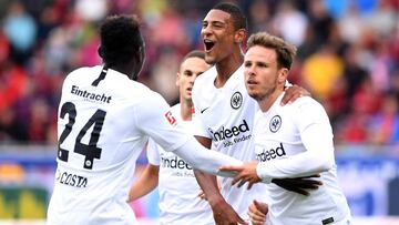 FREIBURG GERMANY - AUGUST 25: (L-R) Danny da Costa, Sebastien Haller and Nicolai Mueller of Eintracht Frankfurt celebrating opening goal of Nicolai Mueller during the Bundesliga match between Sport Club Freiburg and Eintracht Frankfurt at Schwarzwald-Stad