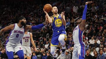Dec 1, 2018; Detroit, MI, USA; Golden State Warriors guard Stephen Curry (30) shoots against Detroit Pistons center Andre Drummond (0) and guard Reggie Jackson (1) during the fourth quarter at Little Caesars Arena. Mandatory Credit: Raj Mehta-USA TODAY Sports