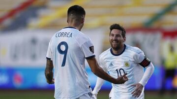 Argentina's Joaquin Correa, left, celebrates scoring his side's second goal against Bolivia with teammate Lionel Messi during a qualifying soccer match for the FIFA World Cup Qatar 2022 in La Paz, Bolivia, Tuesday, Oct. 13, 2020. (AP Photo/Juan Karita)