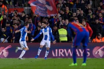 Leganes' midfielder Unai Lopez (R) celebrates his goal with Leganes' defender Alberto Martin during the Spanish league football match FC Barcelona vs CD Leganes at the Camp Nou stadium in Barcelona on February 19, 2017. / AFP PHOTO / Josep Lago