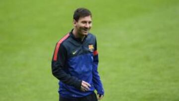 Barcelona's striker Lionel Messi laughs during the final team training on the eve of the UEFA Champions League semi final first leg football match between FC Bayern Munich and FC Barcelona at the arena in Munich, southern Germany, on April 22, 2013. The semi final match will take place on April 23, 2013. AFP PHOTO/CHRISTOF STACHE