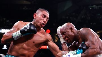 LAS VEGAS, NEVADA - SEPTEMBER 30: Yordenis Ugas (white trunks) trades punches with�Mario Barrios (black trunks)�during their�middleweight fight at T-Mobile Arena on September 30, 2023 in Las Vegas, Nevada.   Sarah Stier/Getty Images/AFP (Photo by Sarah Stier / GETTY IMAGES NORTH AMERICA / Getty Images via AFP)