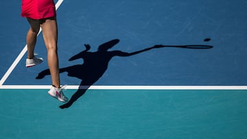 Oceane Dodin of France hits a serve against Coco Gauff of the United States.