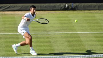 Serbia's Novak Djokovic returns the ball to Canada's Felix Auger-Aliassime during their men's exhibition singles match at The Giorgio Armani Tennis Classic tournament at the Hurlingham Club, in London, on June 22, 2022. (Photo by Adrian DENNIS / AFP)