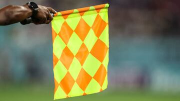 The Assistant Referee raises his flag for offside