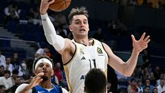 Real Madrid's Croatian forward Mario Hezonja jumps for the ball during the NBA Preseason game between the Dallas Mavericks and Real Madrid Baloncesto at the Wizink centre in Madrid on October 10, 2023.